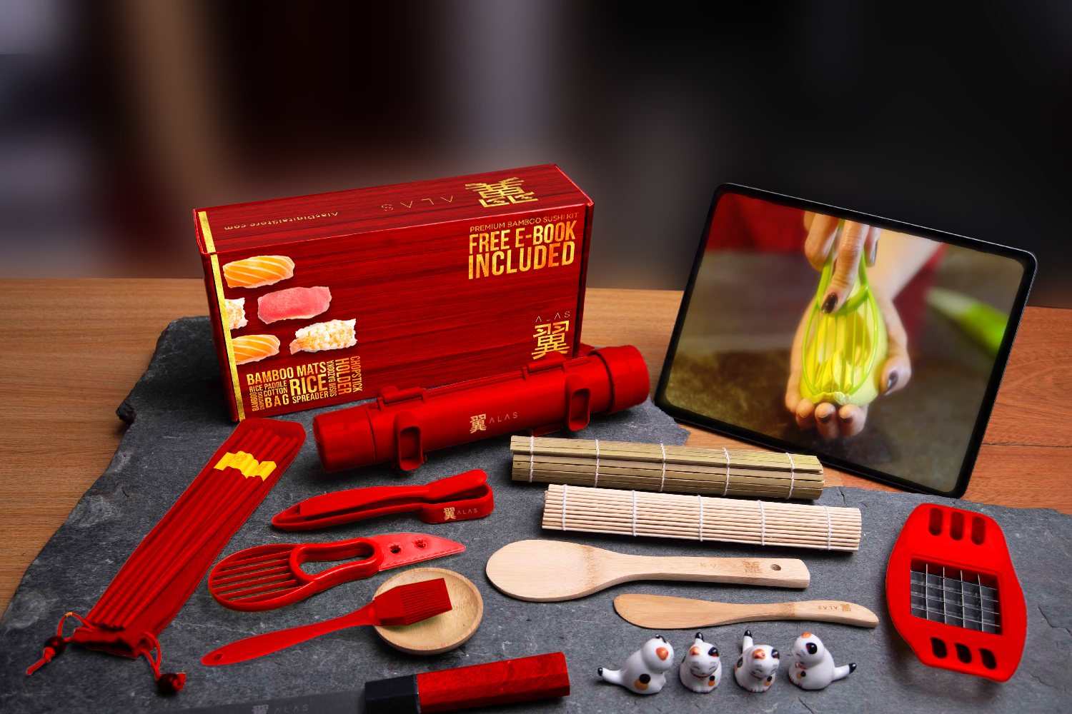 The red kit on slate next to a tablet playing the tutorial