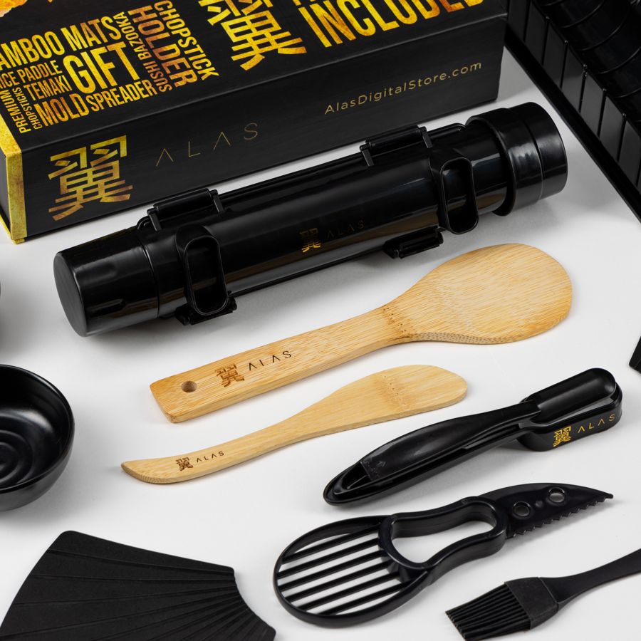 Premium black kit: black sushi bazooka, bamboo paddles, avocado slicer and brush in front of the black gift box